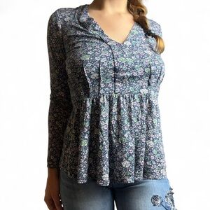 Blue floral peplum top with V neck, long sleeves, and flowy bottom